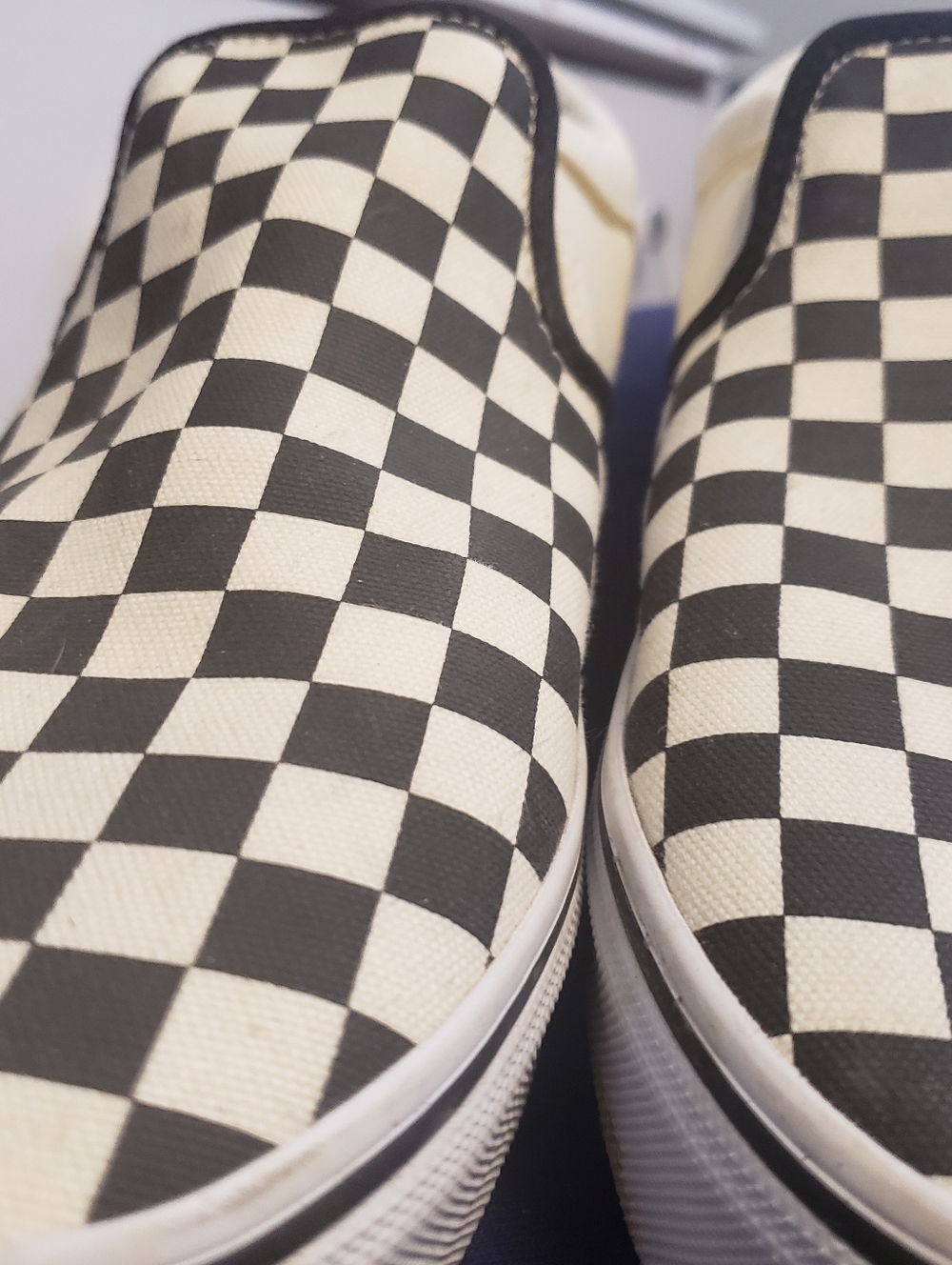 Vans Black and White Checkerboard Slip-On Sneakers